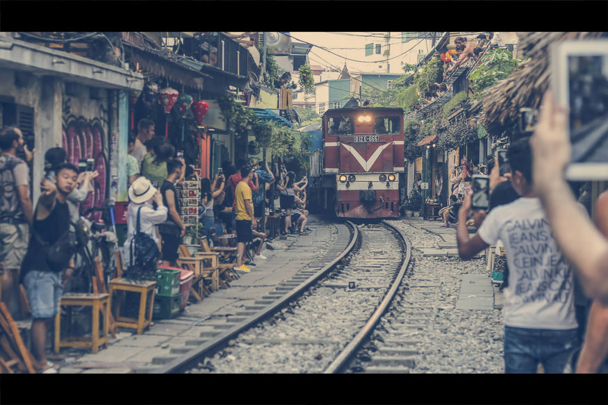 hold down Shift + Alt while switching to aspect ratio and resizing around the center of the image