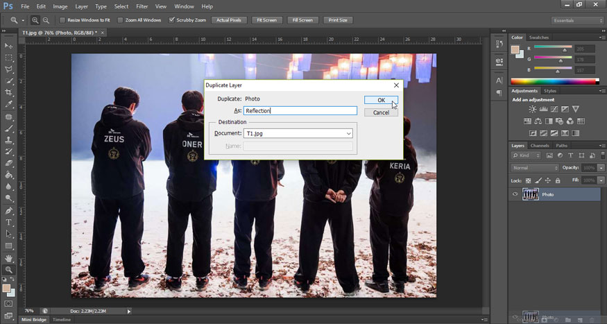 Hold down the Alt (Win) / Option (Mac) key on the keyboard and then drag the Photo layer down