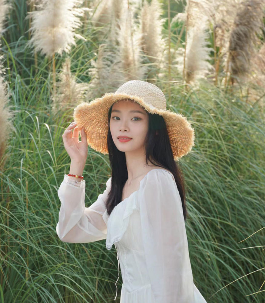 Posing with a hat
