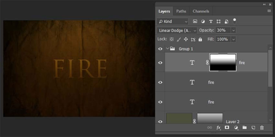 Add a layer mask then draw a gradient so that the new text layer fades out